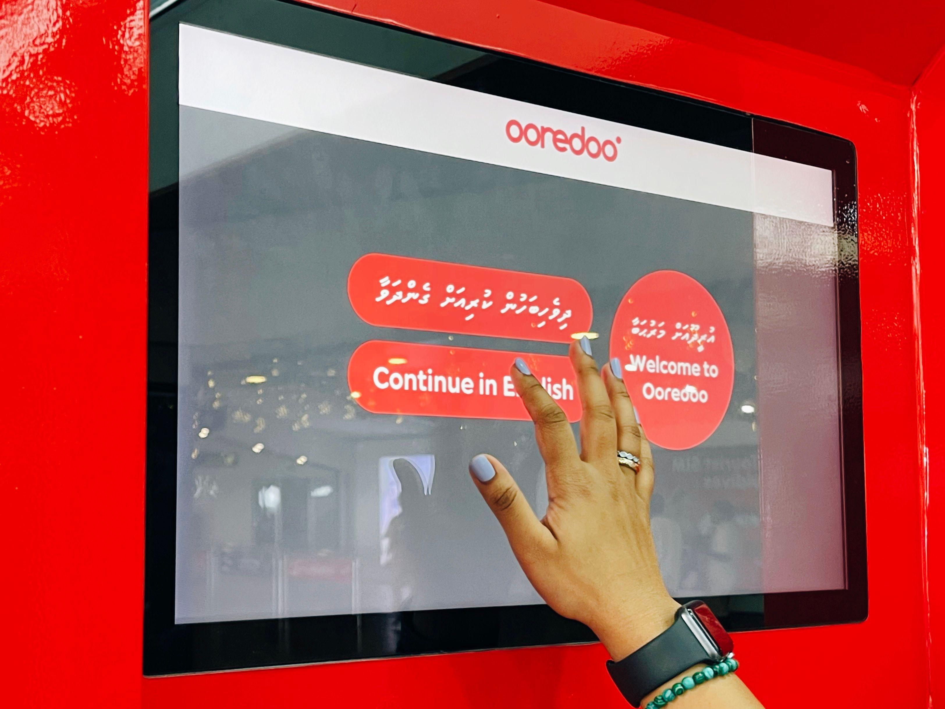 Ooredoo Maldives self-service kiosk at airport close-up