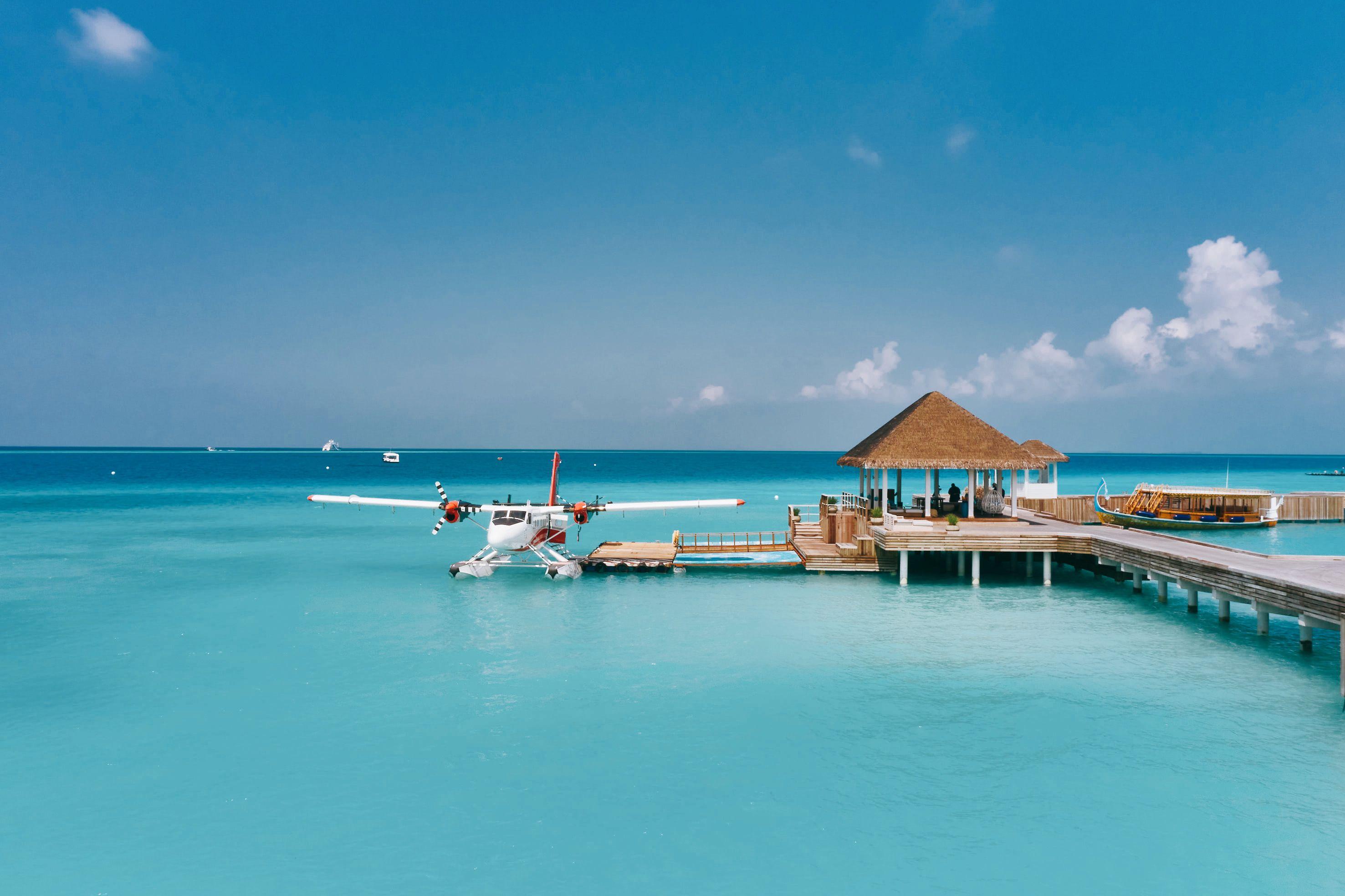 Seaplane docked at a resort's jetty in the Maldives