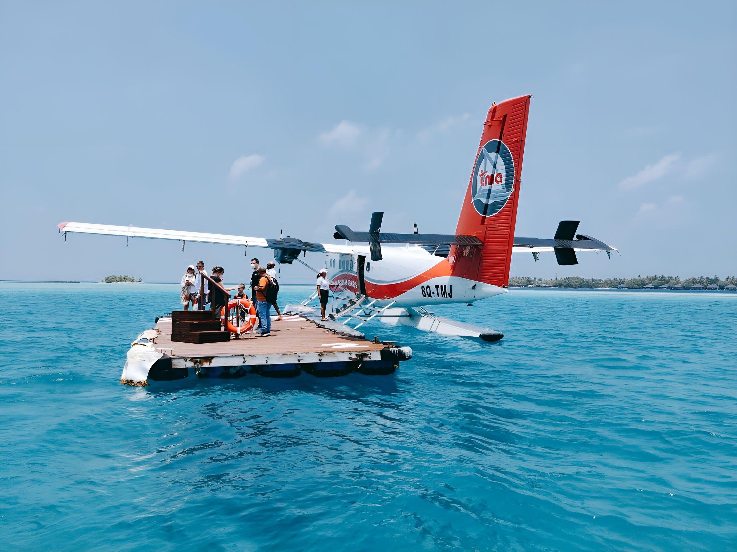 Passengers outside the seaplane in the Maldives