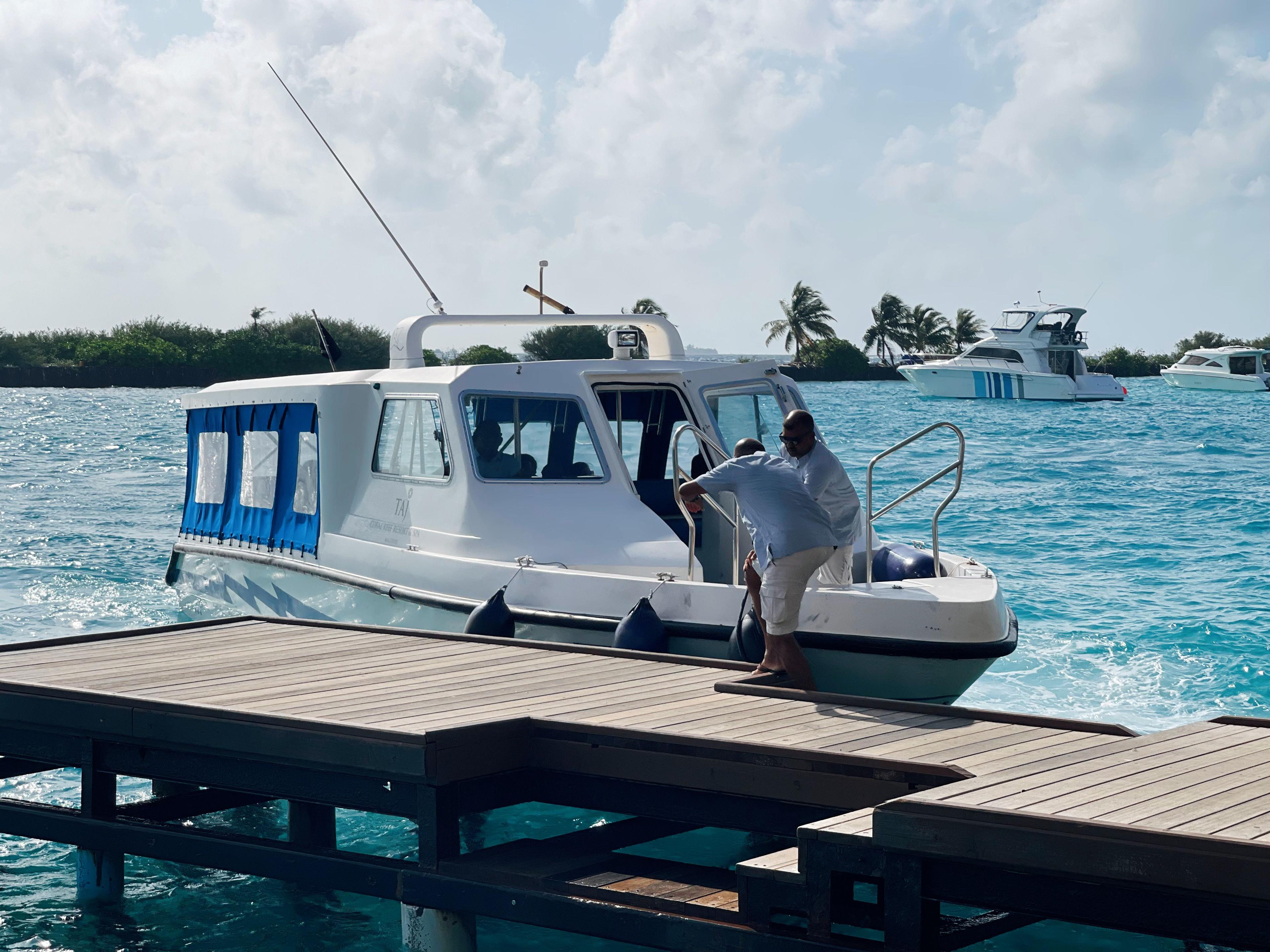 Crew docking a speedboat in the Maldives