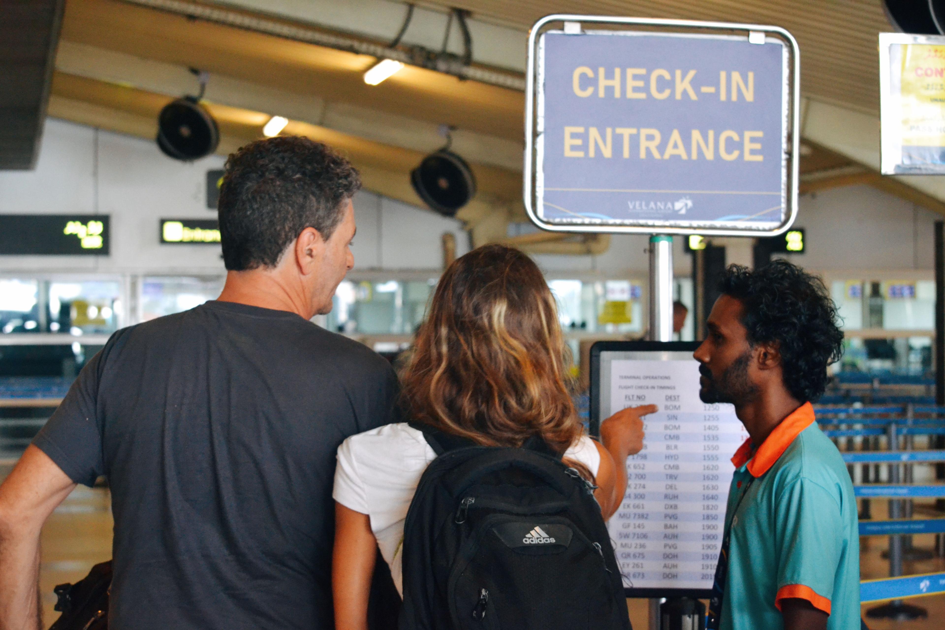 tourists at the velana international airport check-in entrance