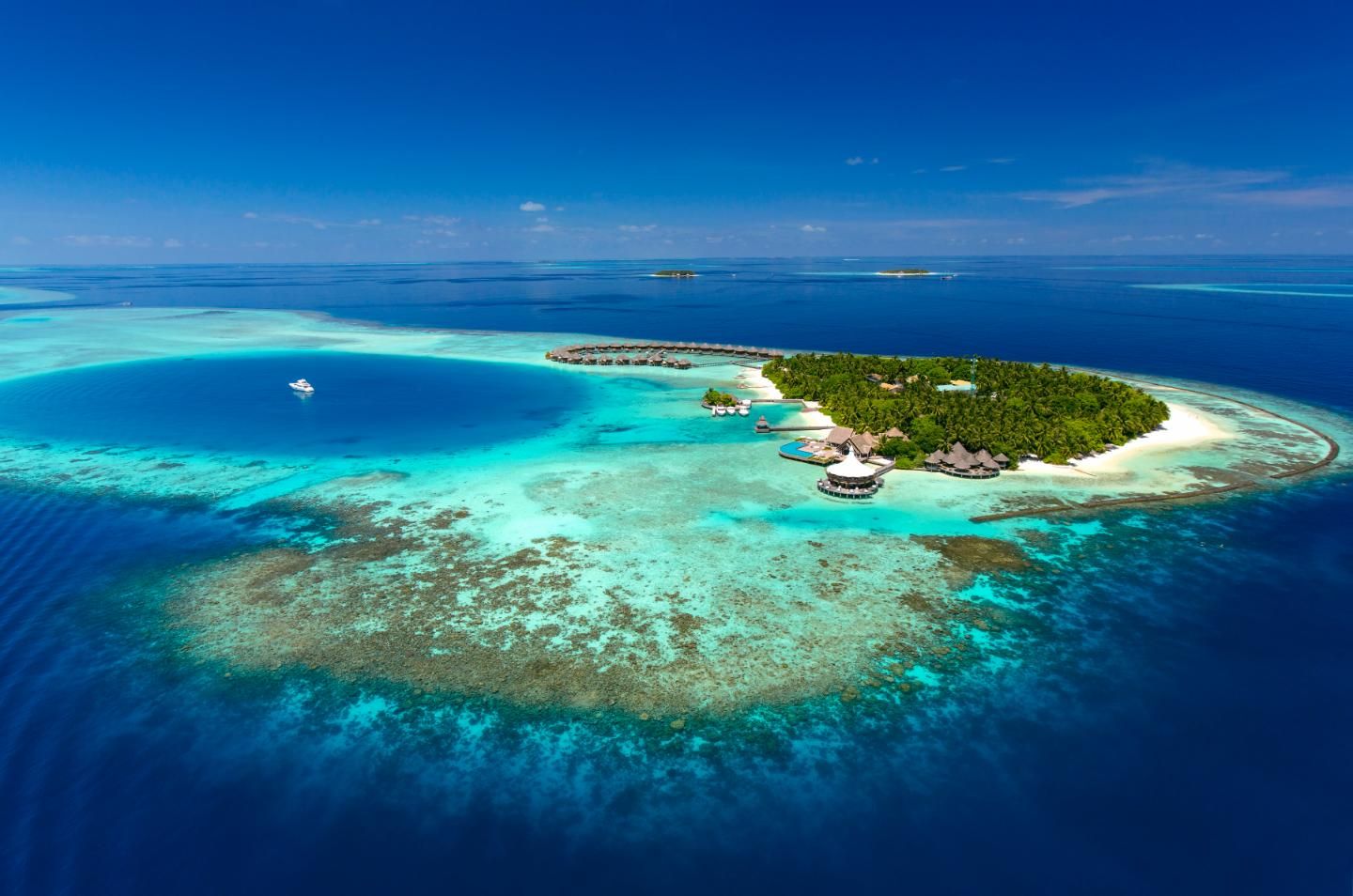 Baros Maldives - Resort - Aerial - Island and Reef.jpg