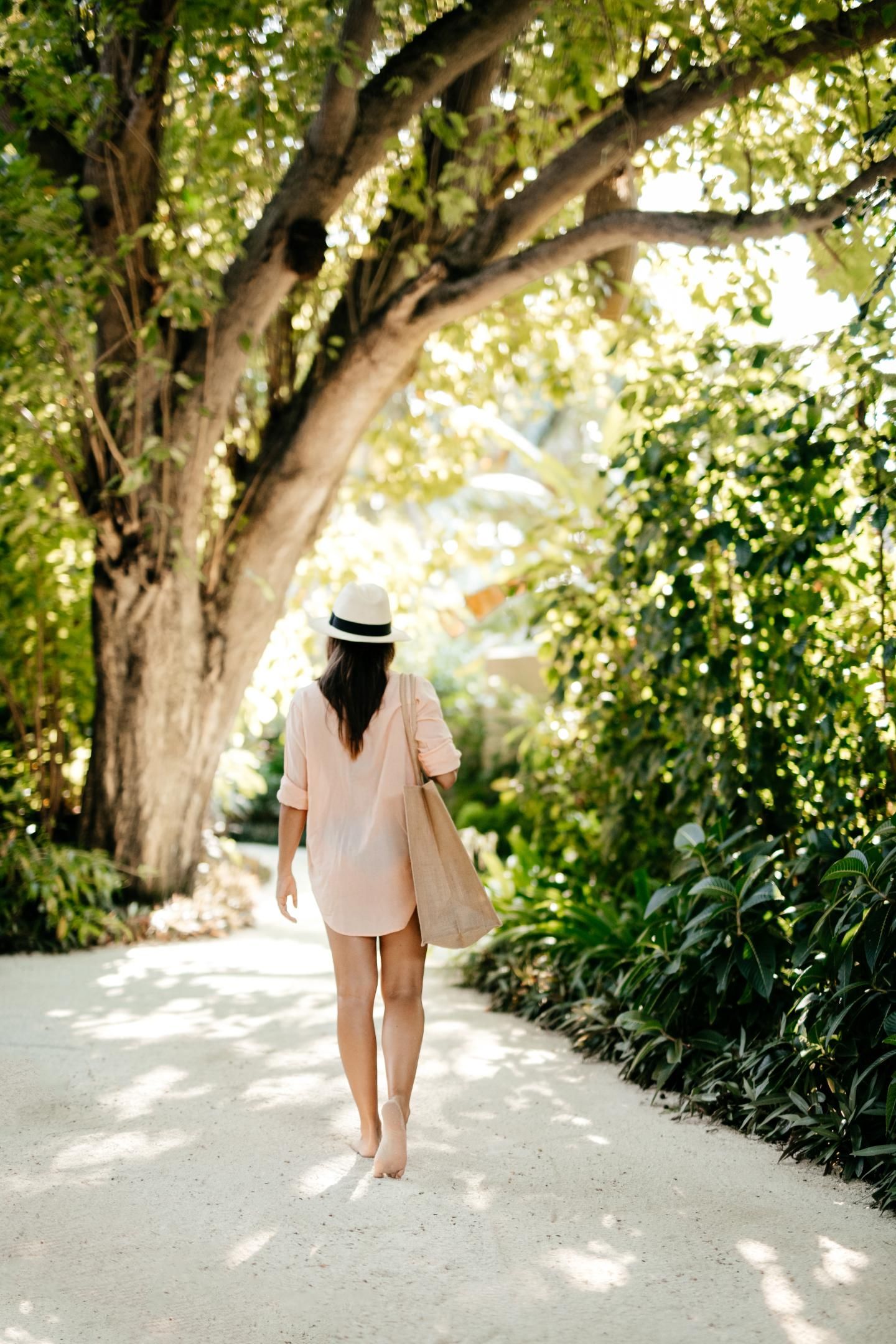 Baros Maldives - Resort - Mood - Lady Walking.jpg