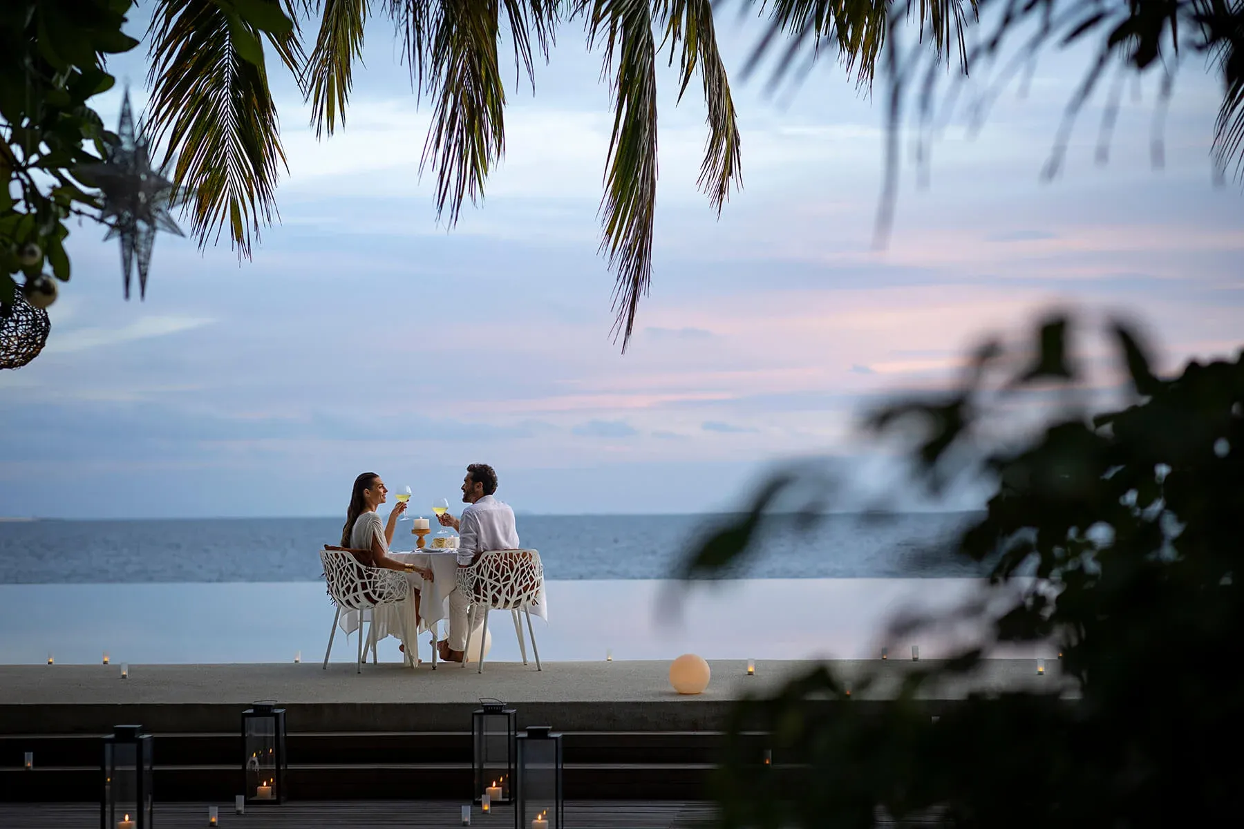 Huvafen Fushi Maldives - Resort - Mood - Couple Having Dinner.webp