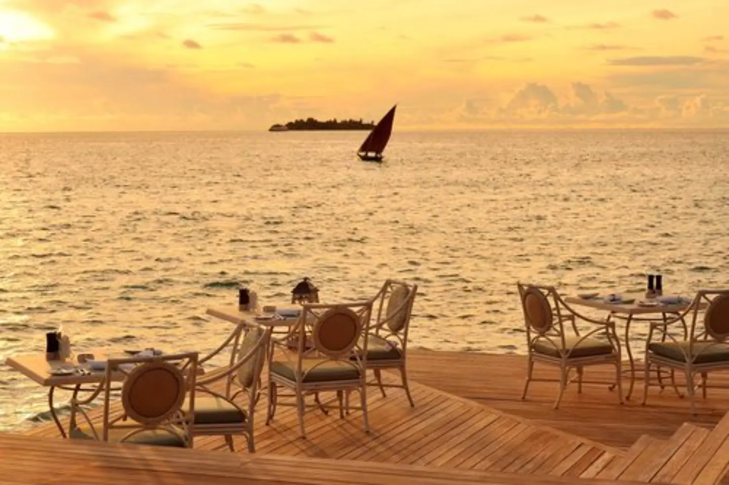 Ayada-Maldives-Facilities-Restaurant-Ocean-Breeze-Sundeck-at-Evening.webp